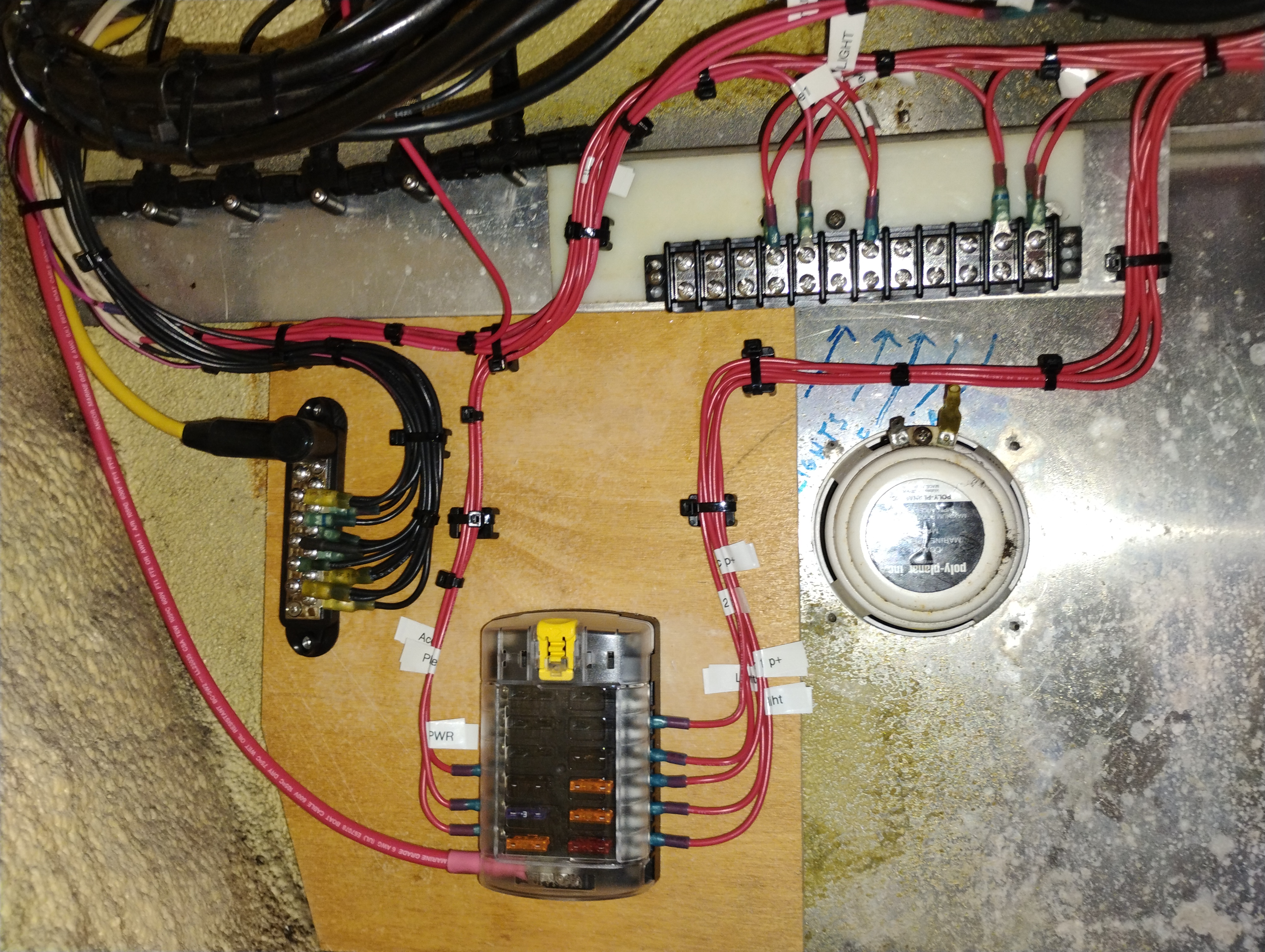 Older yacht electrical panel showing decades of accumulated DIY wiring additions