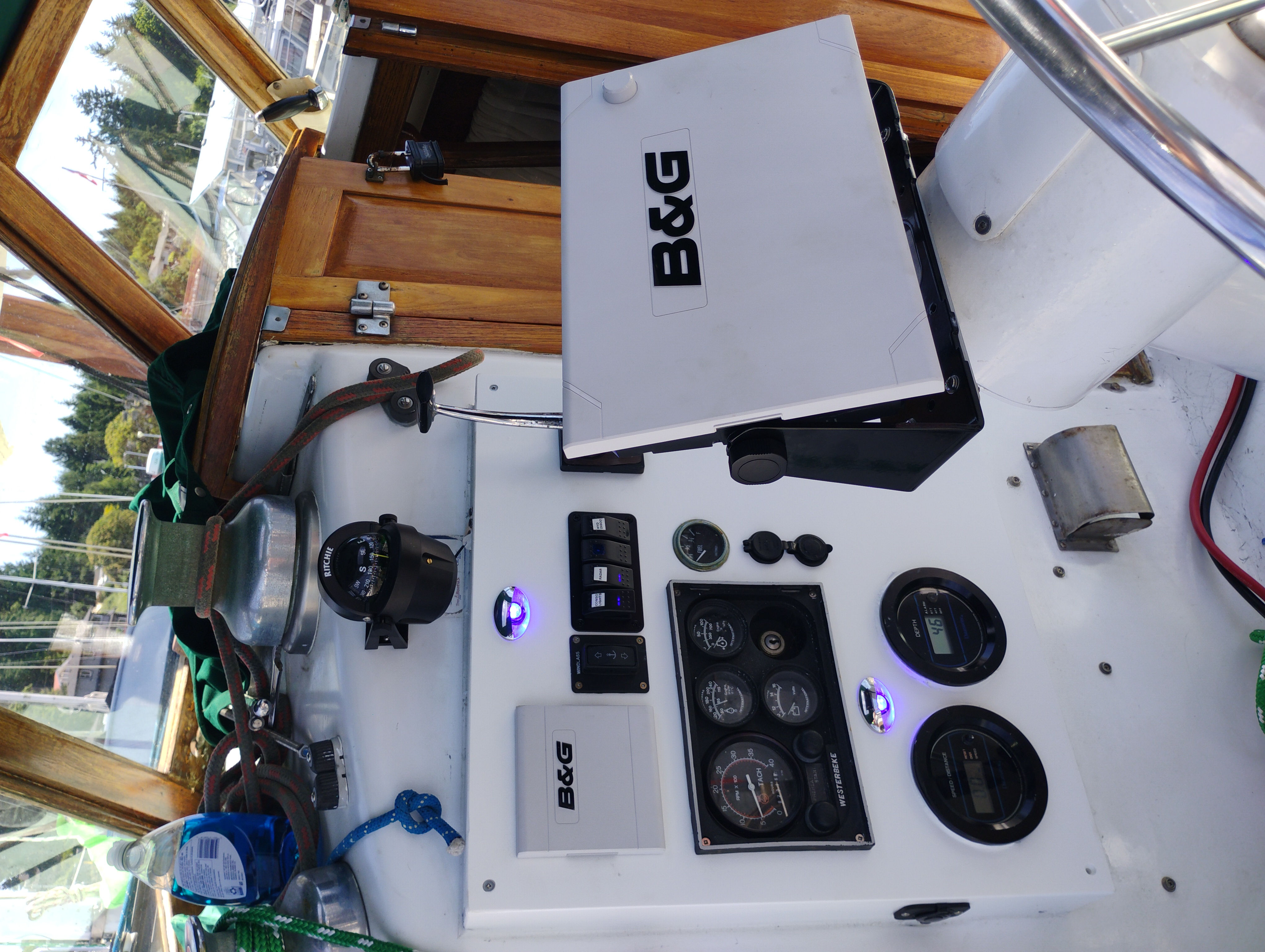 B&G chartplotter and Garmin marine electronics components new in packaging on a workbench